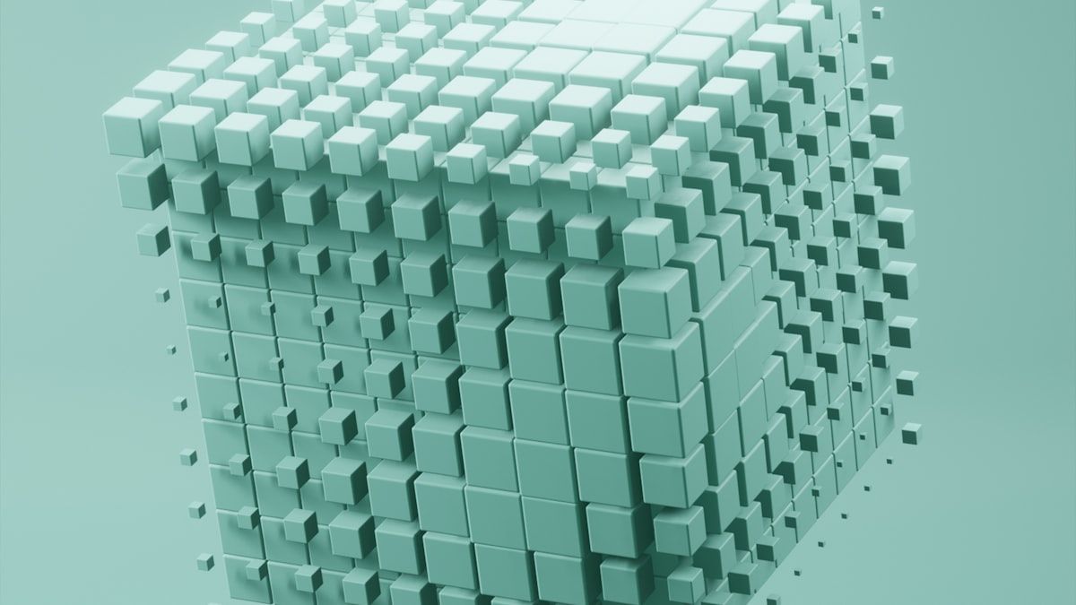 AI時代に役割が変わることを表す、ミントグリーンの立方体が集まる抽象的な3D